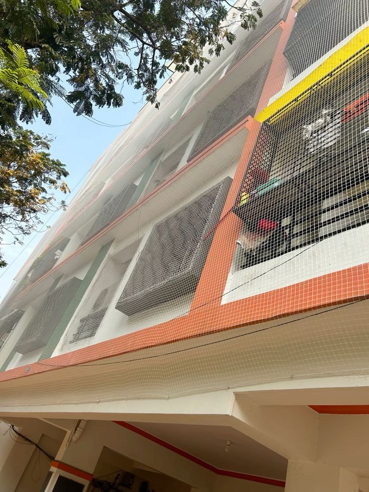 Multi-story apartment building exterior safety netting